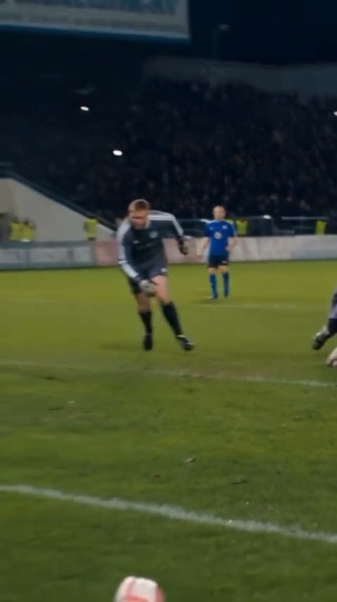 At fourteen seconds, part of the ball is near the bottom edge and the goal mouth is outside the frame